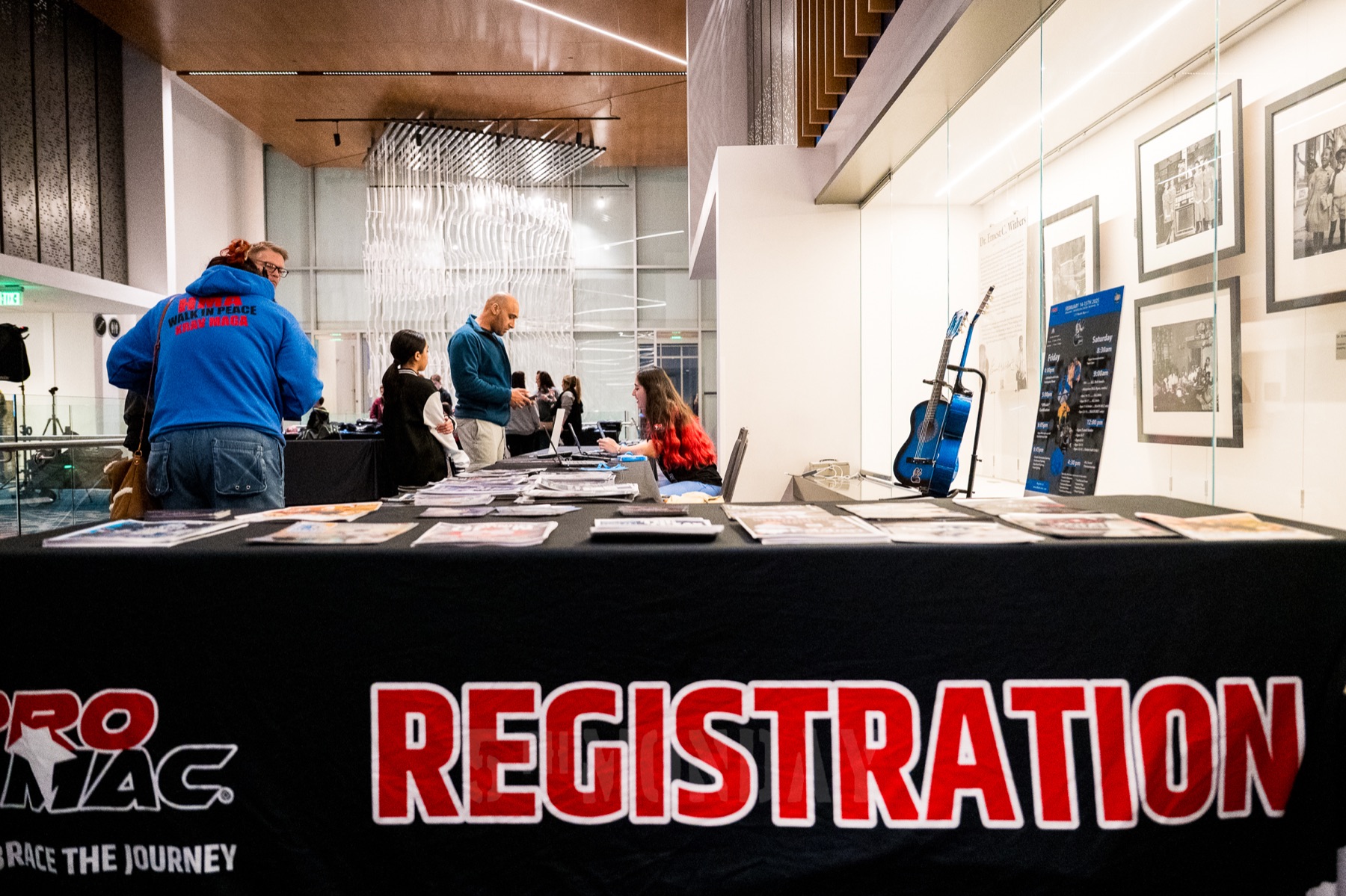PROMAC families checking in at event registration